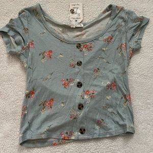 The brand is Hippie Rose. It’s a floral print. Never worn. Size x small